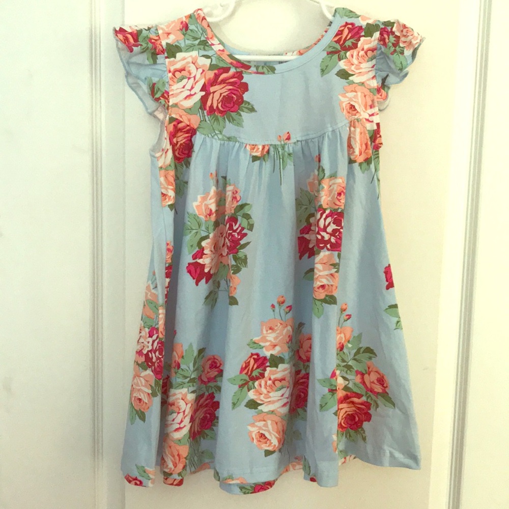 Size 5 floral pearl dress with matching shorts.